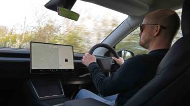 Tesla Model Y - interior driving shot with Auto Express Chief reviewer, Alex Ingram